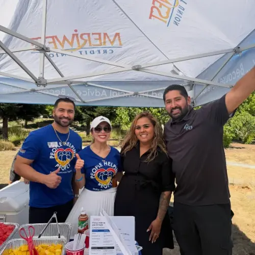 Maria and partners at a Home Pros community event booth