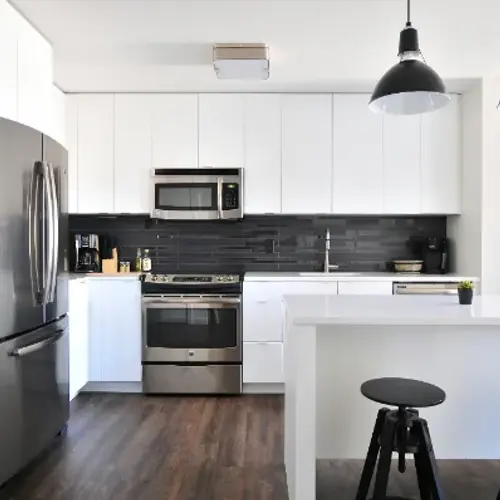 Clean white kitchen after a house cleaning